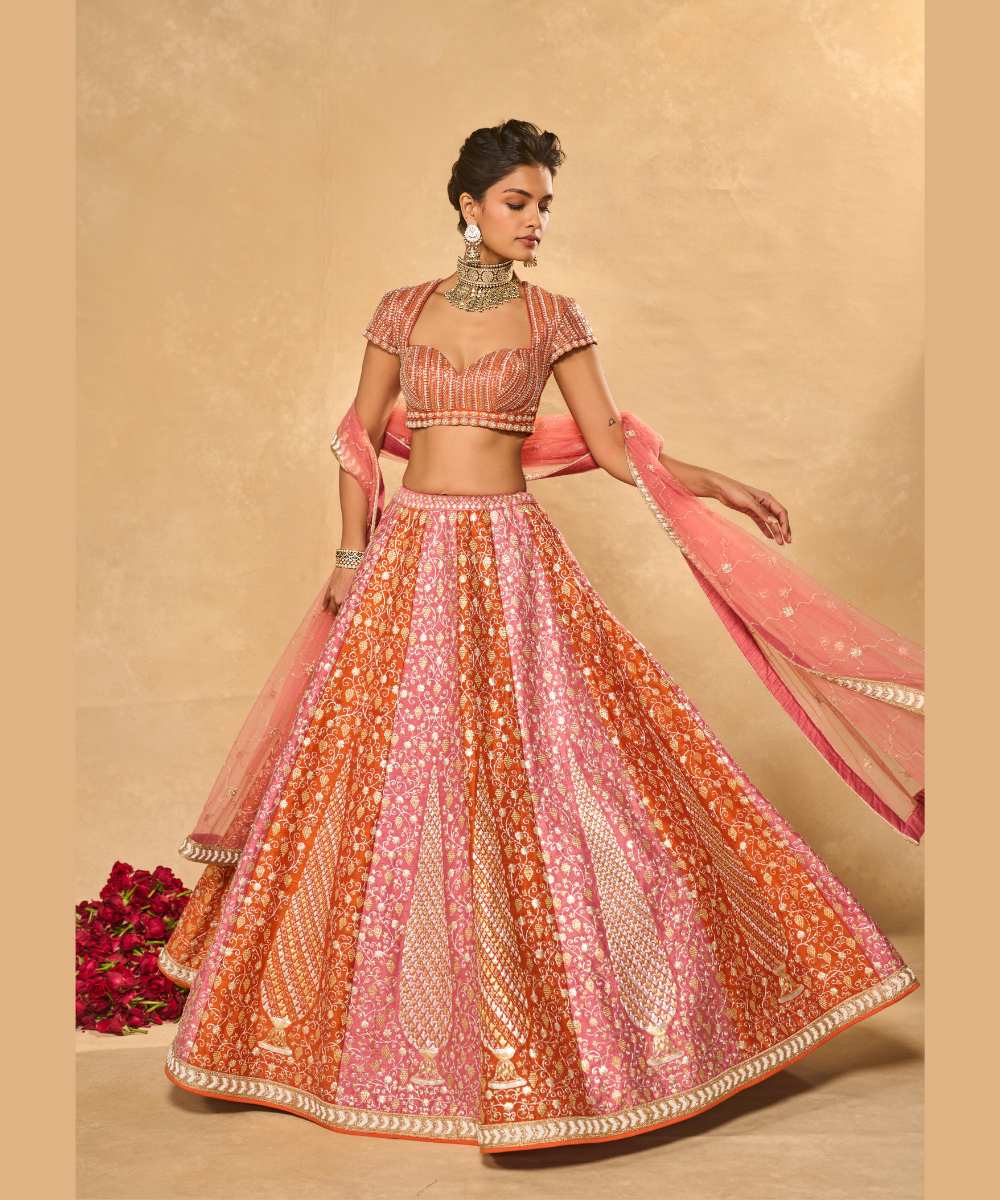 SABA LEHENGA - Mauve Pink and Orange lehenga intricately embroidered with pita, glass beads, stones, pearls, zardozi, and zari paired with a delicately embellished sweetheart neck cap sleeve blouse -  Leher by Chamee and Palak