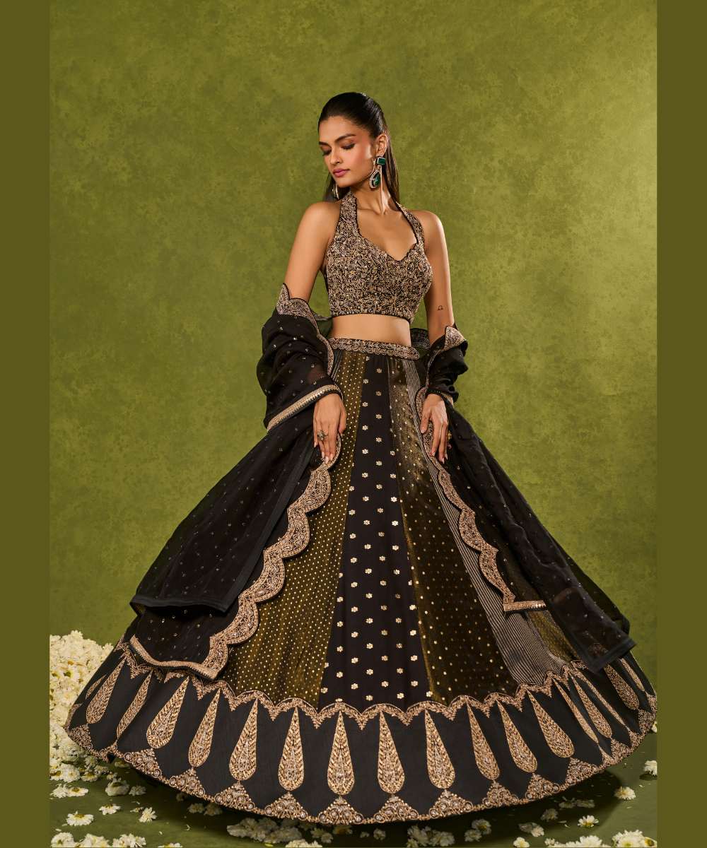 NANDANA LEHENGA - Black tissue woven jamewar lehenga delicately embroidered with a zari hem paired with a richly embroidered halter-neck blouse - Leher by Chamee and Palak