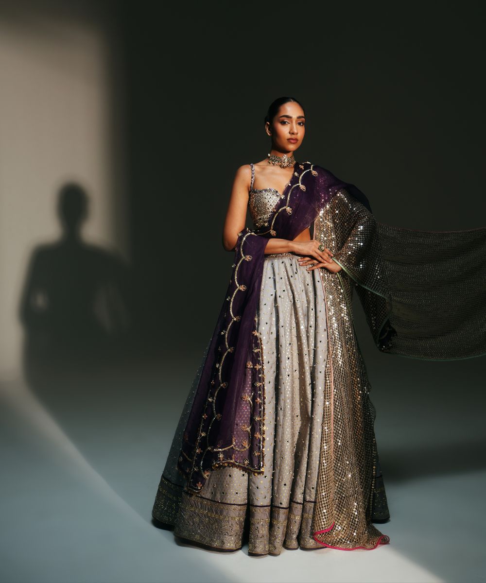 CHANDANI - HEAVY HAND EMBROIDERED KALI LEHENGA PAIRED WITH BRALETTE BLOUSE WITH CRIS-CROSS DEATILING AT THE BACK - Mehfil by Mahima