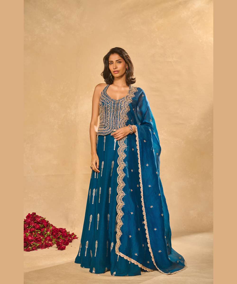 AMAL LEHENGA IN BLUE - Jamewar Lehenga with woven buttis paired with zari, sequence and zardozi embroidered halter neck blouse - Leher by Chamee and palak