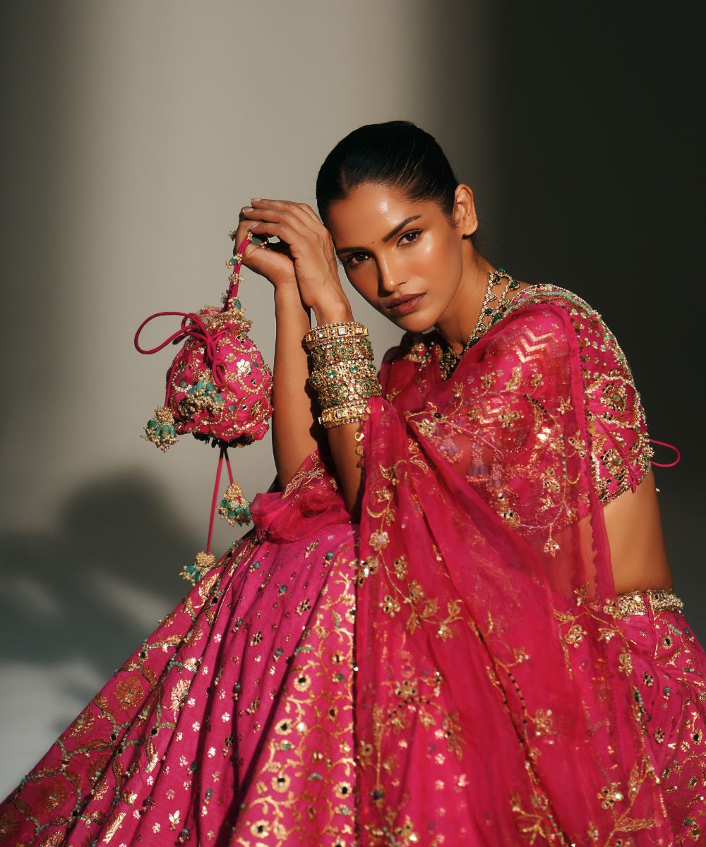 RANI PINK HAND EMBROIDERED POTLI BAG - Mehfil by Mahima Mahajan