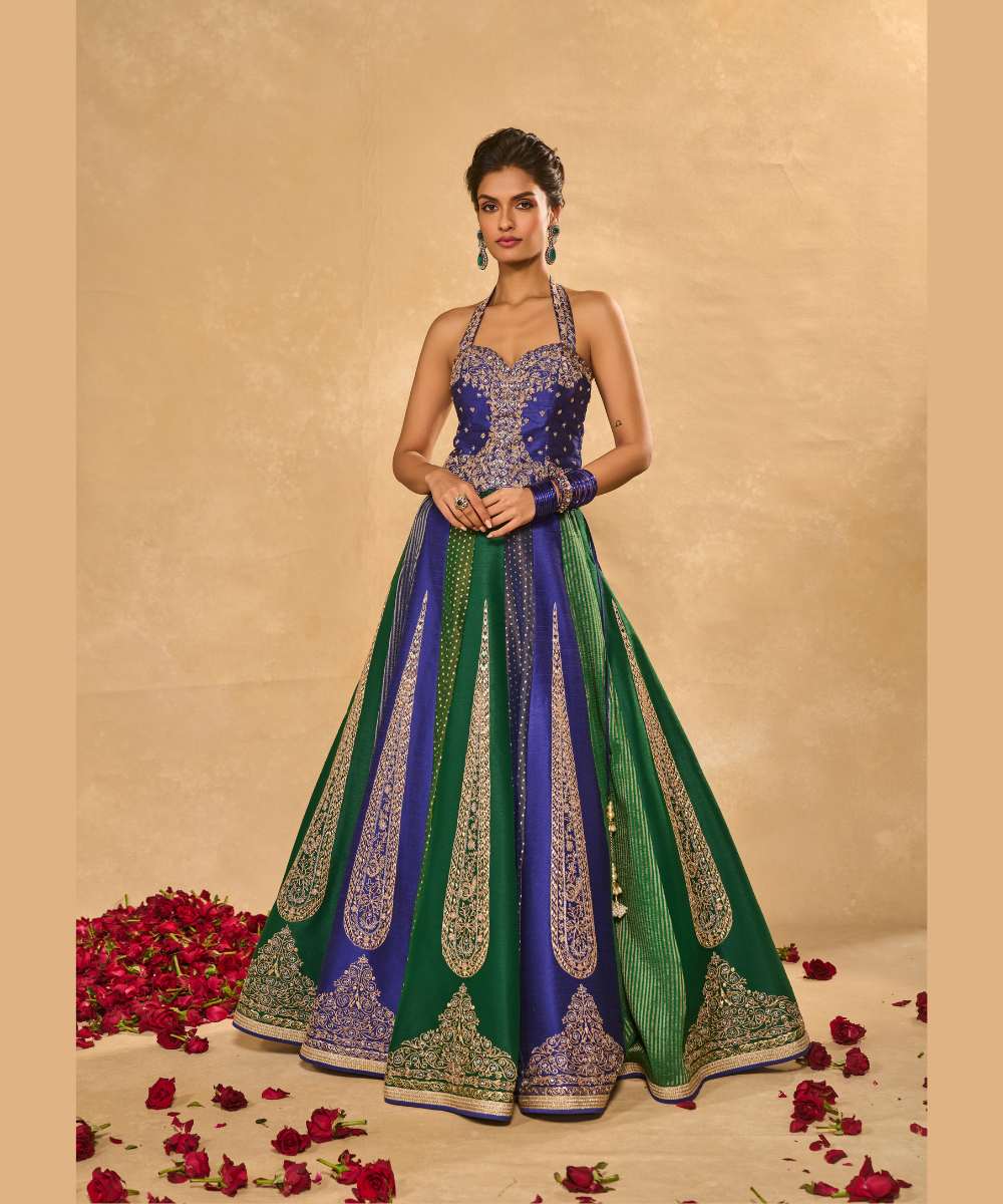 BLUE NAINA LEHENGA - Blue and green dupion silk and tissue jamewar 10 kali lehenga, intricately woven and delicately encrusted with zari embroidery paired with a blue halter-neck blouse - Leher by Chamee and Palak