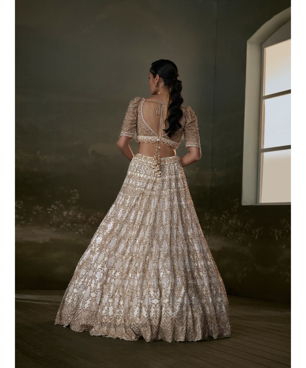 NITIKA GUJRAL - Ivory And Gold Lehenga Choli Set