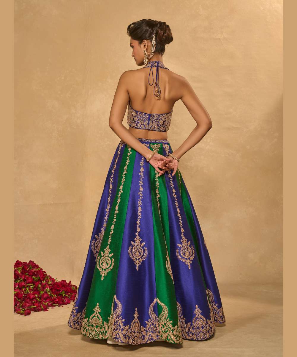 SAIRA LEHENGA - Silk lehenga embellished with luminous zari embroidery, paired with a blue halter neck blouse -  Leher by Chamee and Palak