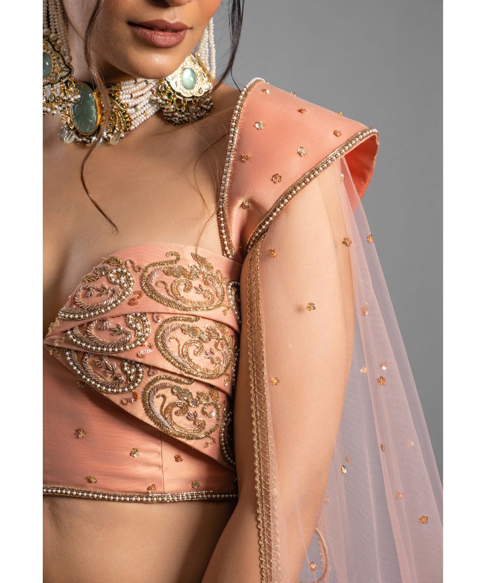 Peach tissue Lehenga with a Draped Blouse
