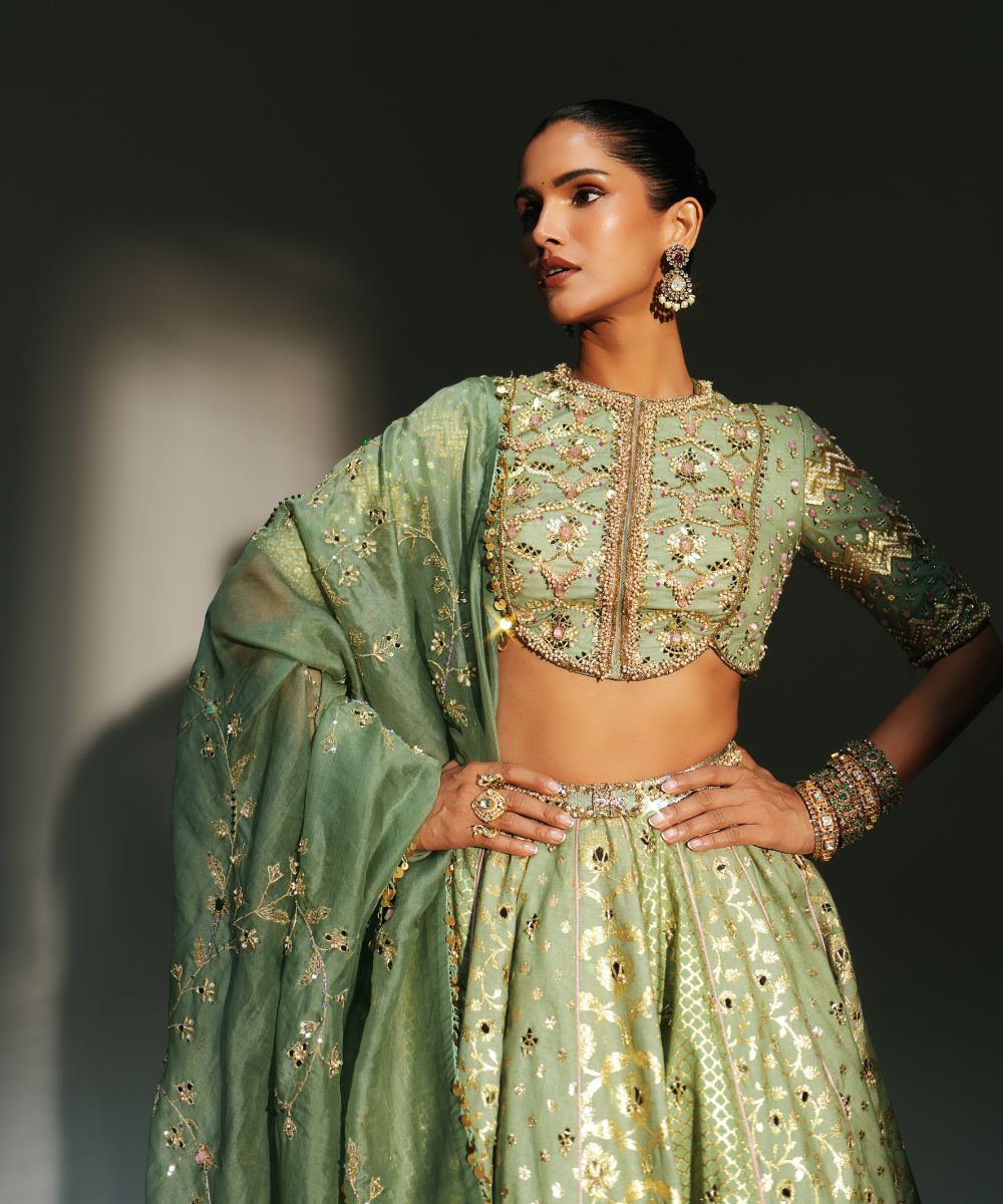 JIYA - HEAVY HAND EMBROIDERED PISTA GREEN KALI LEHENGA - Mehfil by Mahima Mahajan