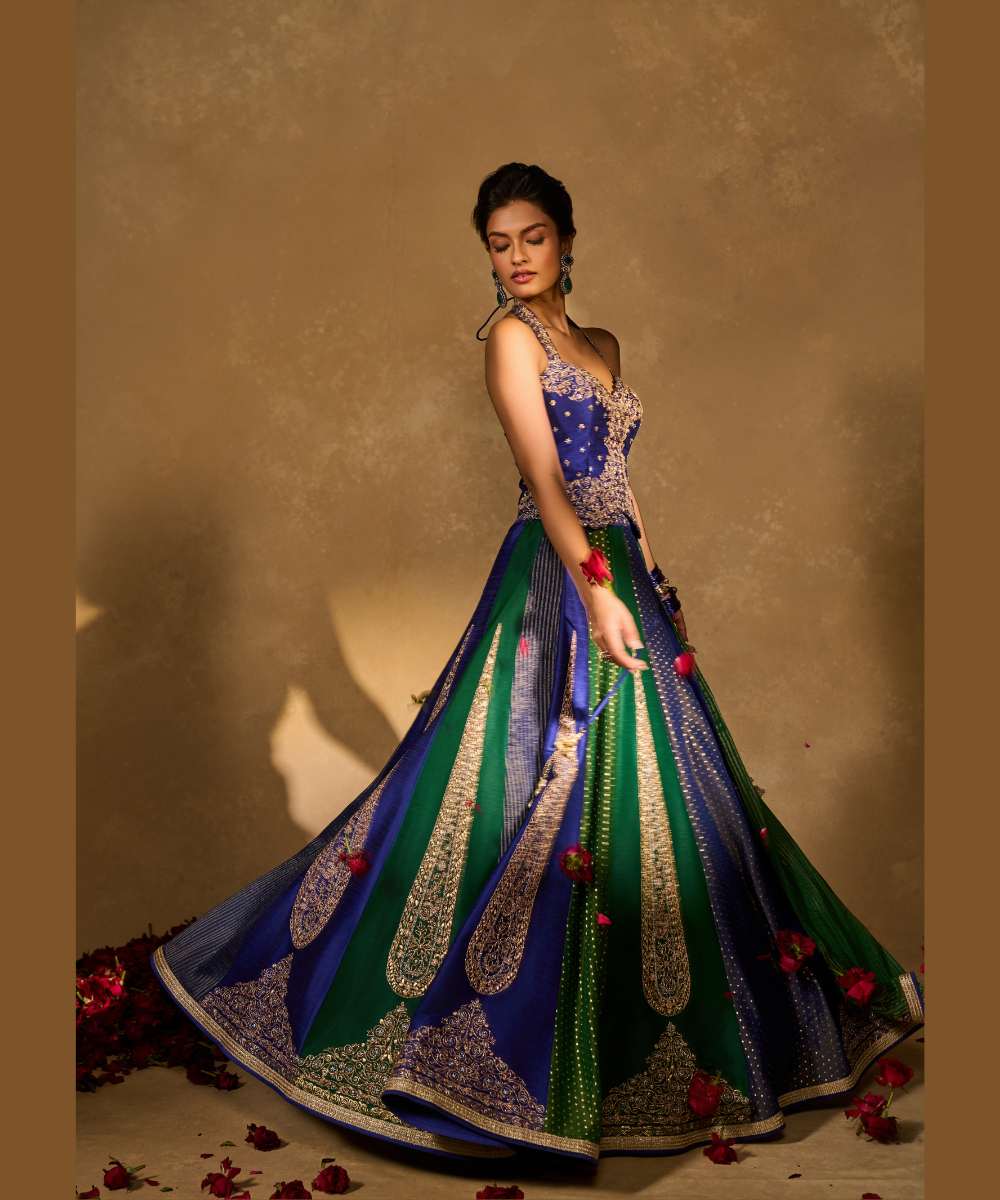 BLUE NAINA LEHENGA - Blue and green dupion silk and tissue jamewar 10 kali lehenga, intricately woven and delicately encrusted with zari embroidery paired with a blue halter-neck blouse - Leher by Chamee and Palak