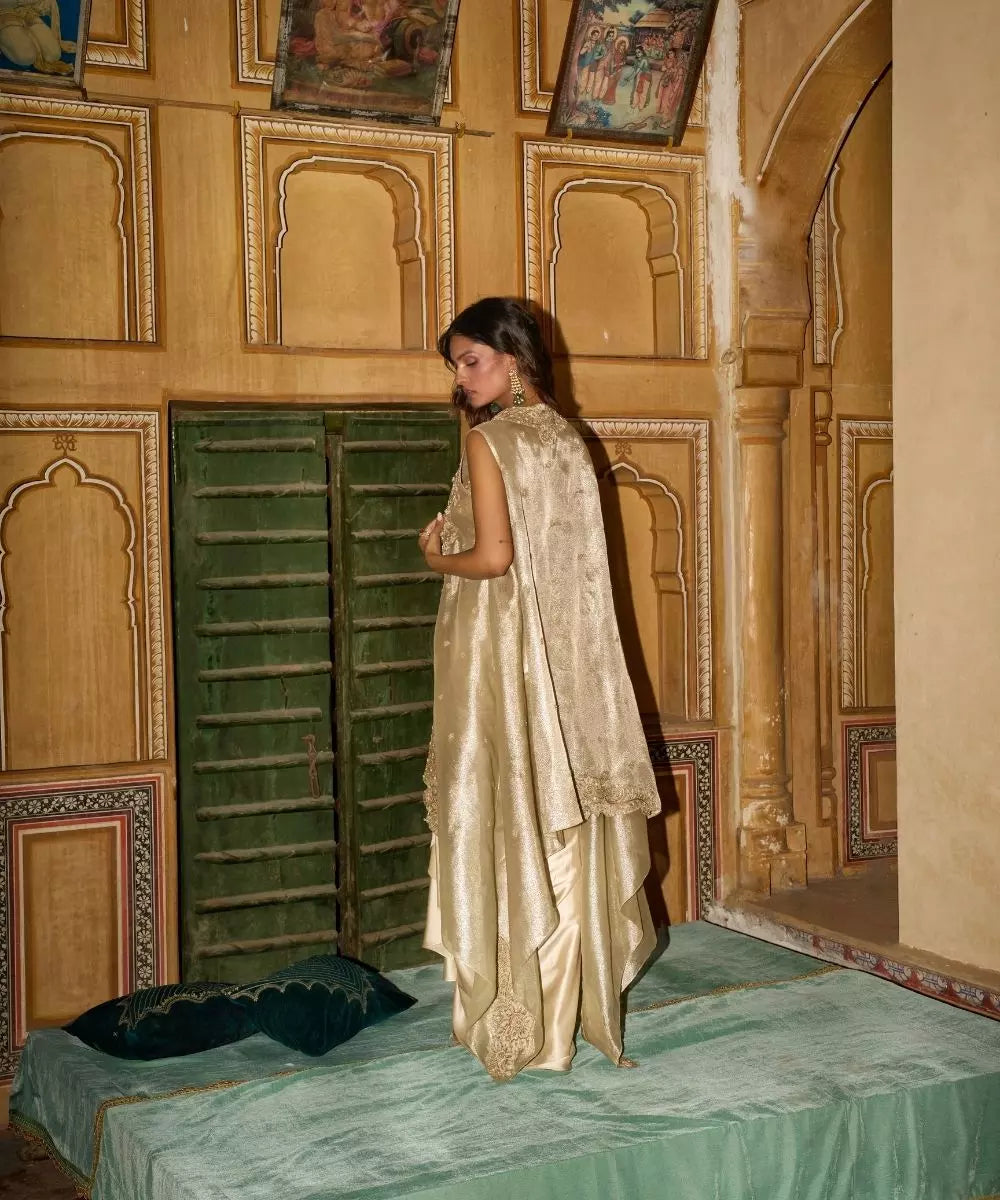 Aditi Gupta -  Champagne Gold drape Satin Skirt  Set with pure Tissue Cape
