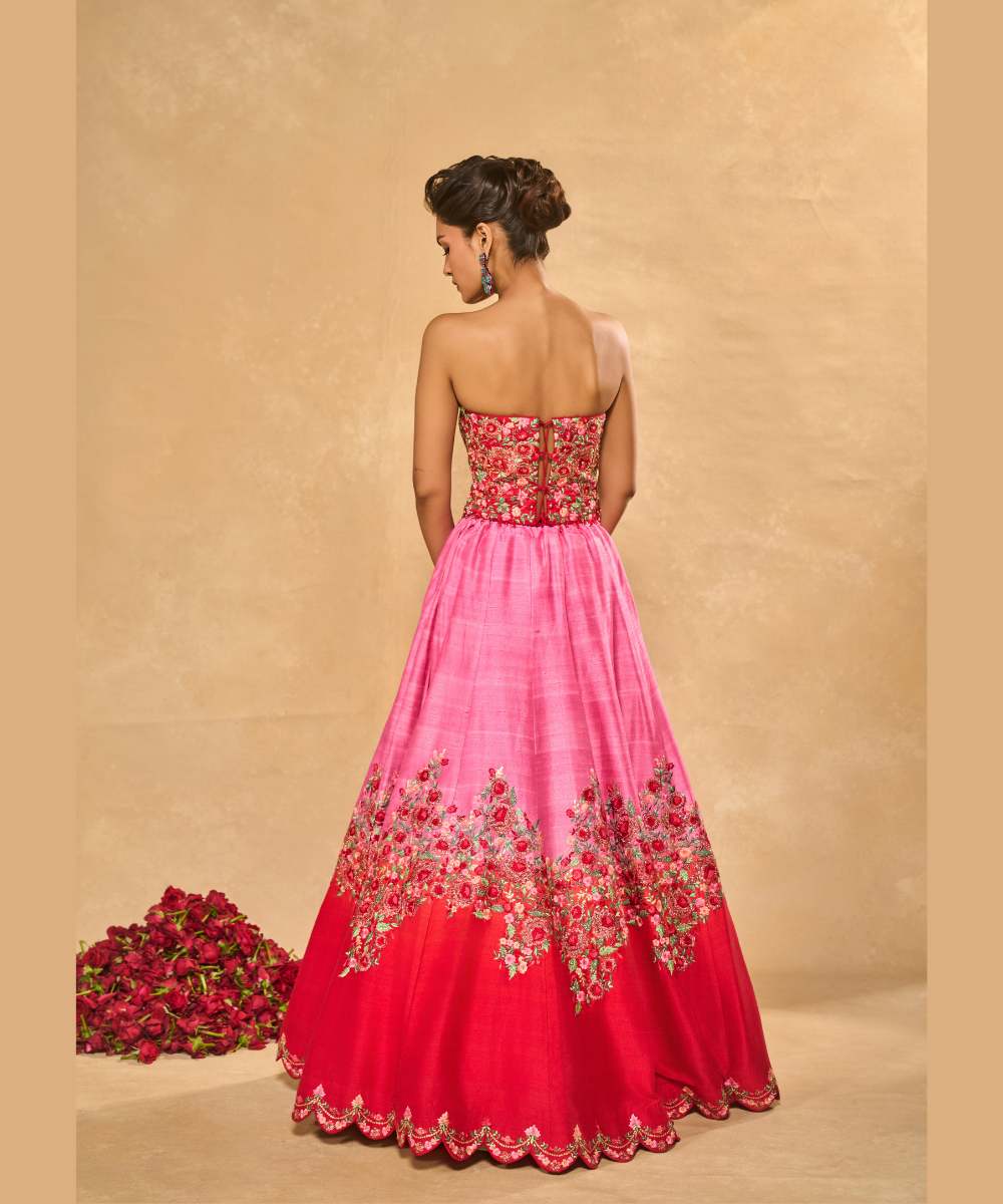 TANYA OMBRE LEHENGA - Pink tor Red ombré lehenga, adorned with delicately embroidered floral motifs in resham and zari paired with a red raw silk corset blouse - Leher by Chamee and Palak