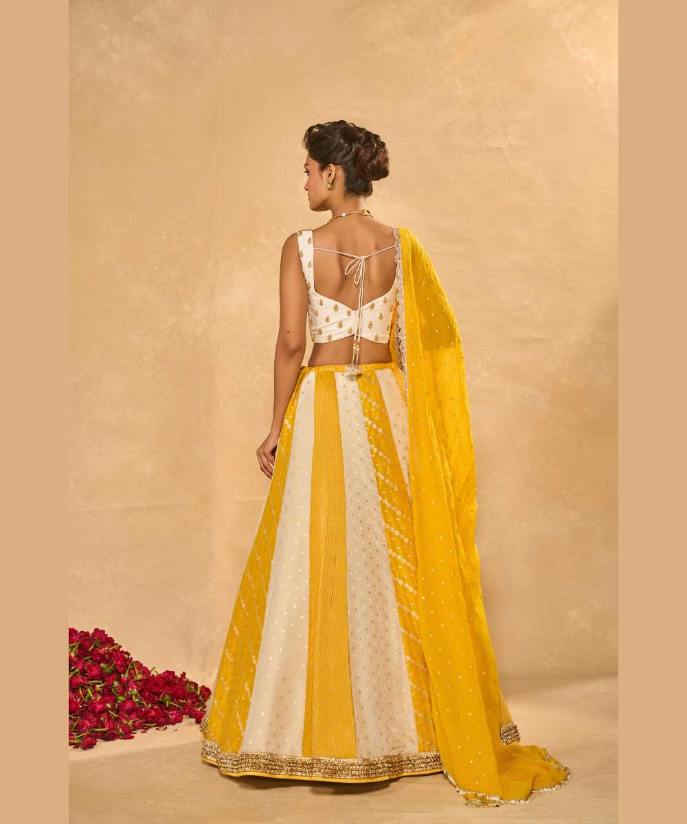 BHUMI LEHENGA - Ivory and yellow tissue jamewar lehenga with yellow organza dupatta encrusted with shimmering sequence -  Leher by Chamee and Palak