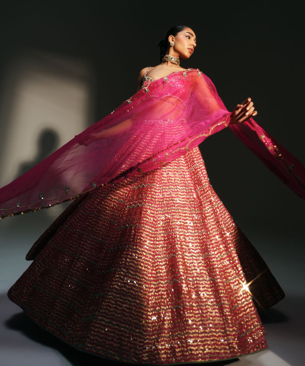 KOMAL- HEAVY HAND EMBROIDERED RANI PINK KALI LEHENGA - Mehfil by Mahima Mahajan