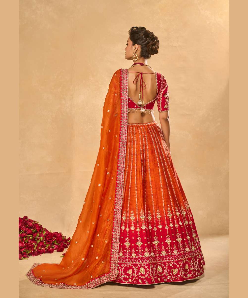 AARIANA LEHENGA - Orange to red ombré raw silk lehenga intricately embellished with zardozi, sequence ,glass beads and pearls paired with a delicately encrusted elbow-sleeve blouse - Leher by Chamee and Palak