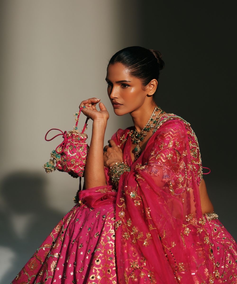 RANI PINK HAND EMBROIDERED POTLI BAG - Mehfil by Mahima Mahajan