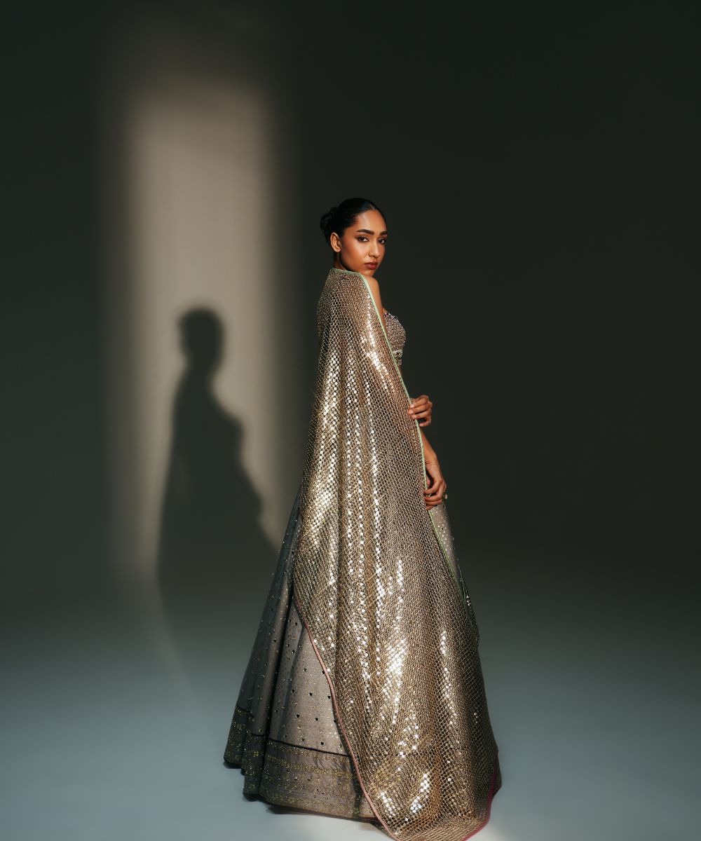 CHANDANI - HEAVY HAND EMBROIDERED KALI LEHENGA PAIRED WITH BRALETTE BLOUSE WITH CRIS-CROSS DEATILING AT THE BACK - Mehfil by Mahima