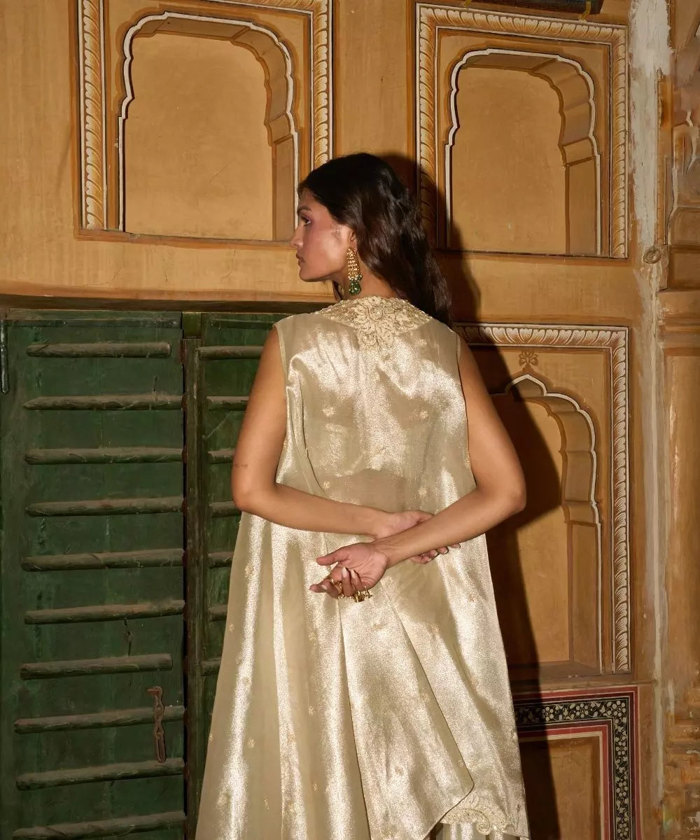 Aditi Gupta -  Champagne Gold drape Satin Skirt  Set with pure Tissue Cape