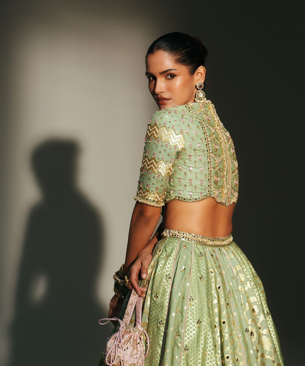 JIYA - HEAVY HAND EMBROIDERED PISTA GREEN KALI LEHENGA - Mehfil by Mahima Mahajan
