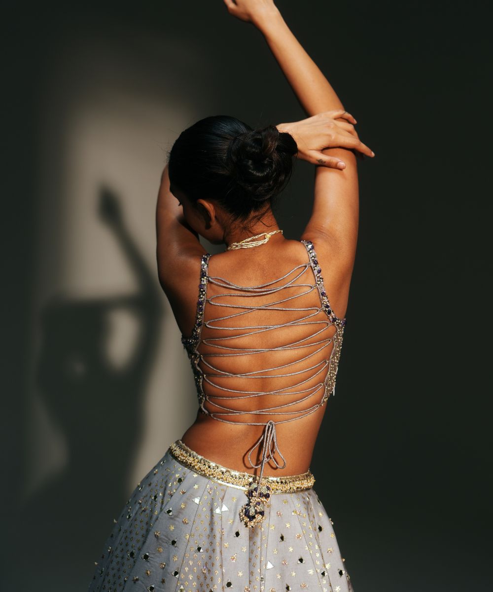 LEELA - HEAVY HAND EMBROIDERED KALI LEHENGA WITH BRALETTE WITH CRIS-CROSS DEATILING AT THE BACK AND CONTRAST DUPATTA - Mehfil by Mahima Mahajan