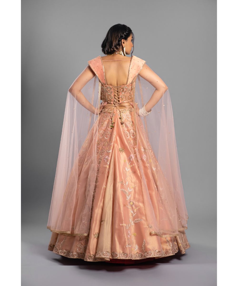 Peach tissue Lehenga with a Draped Blouse