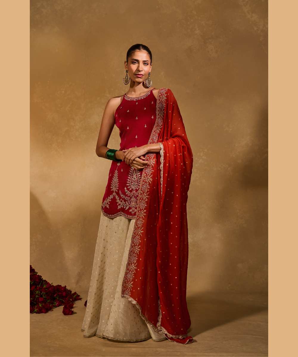 AMBI  SHARARA - Soft silk halter kurta paired with an ivory tissue Jamawar flared pant - Leher by Chamee and Palak