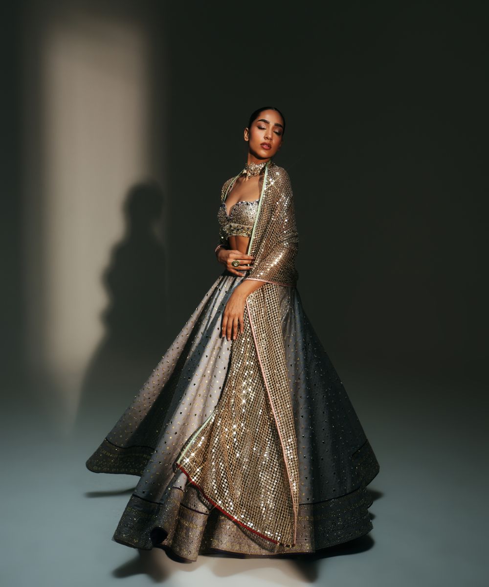 CHANDANI - HEAVY HAND EMBROIDERED KALI LEHENGA PAIRED WITH BRALETTE BLOUSE WITH CRIS-CROSS DEATILING AT THE BACK - Mehfil by Mahima