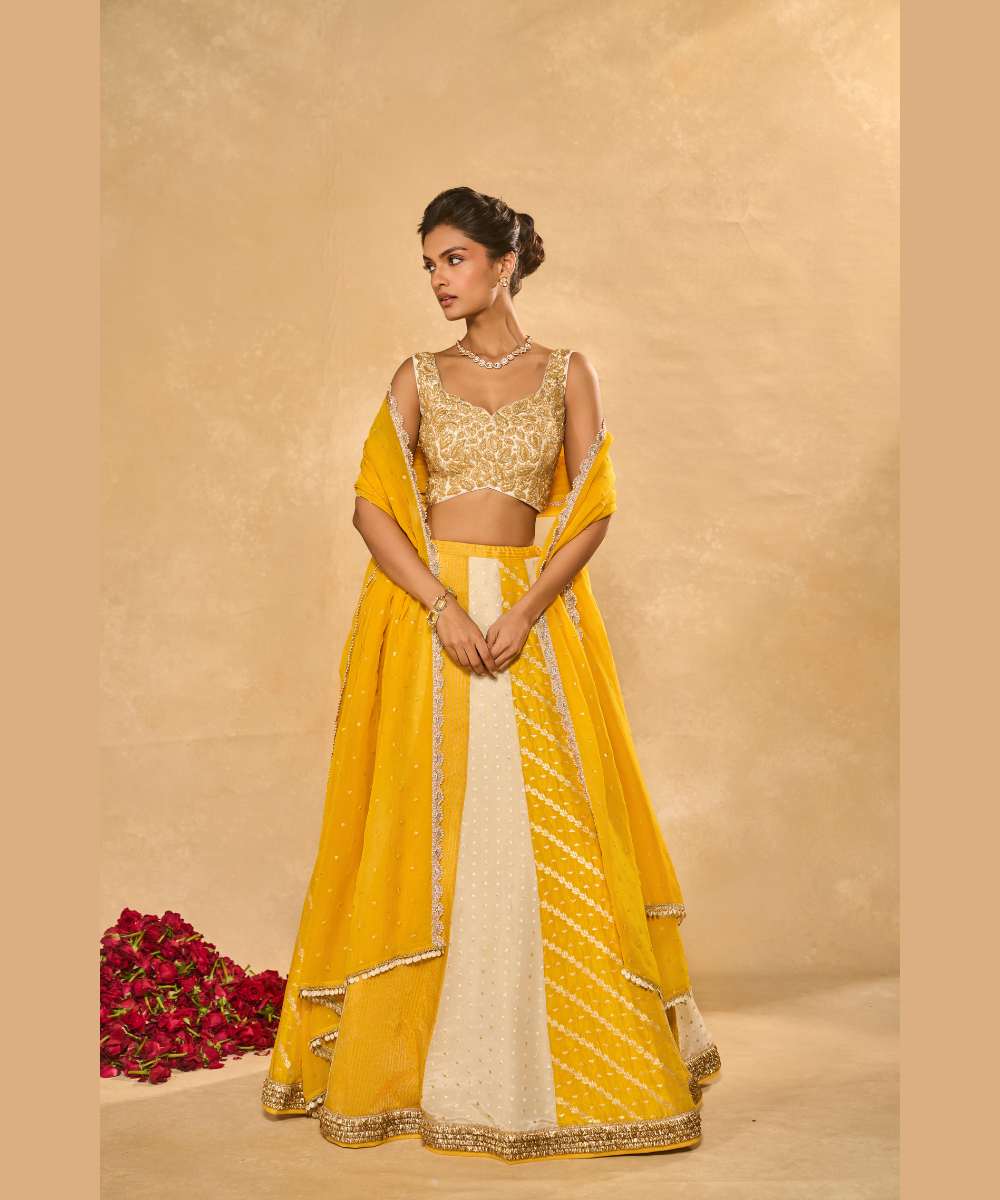 BHUMI LEHENGA - Ivory and yellow tissue jamewar lehenga with yellow organza dupatta encrusted with shimmering sequence -  Leher by Chamee and Palak