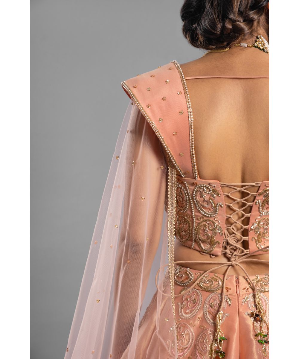 Aastha Sood - Peach tissue Lehenga with a Draped Blouse
