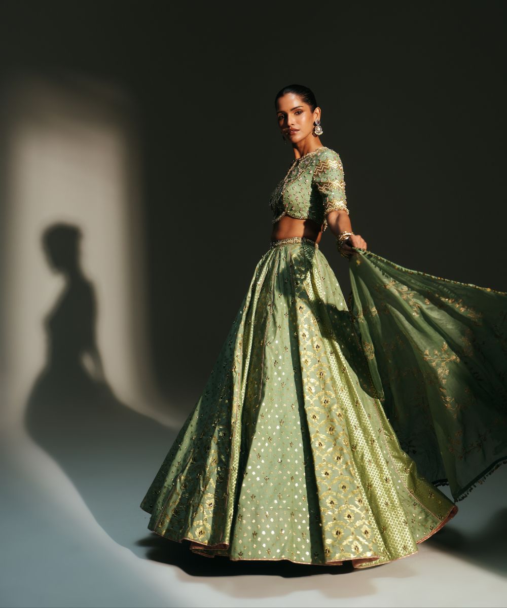 JIYA - HEAVY HAND EMBROIDERED PISTA GREEN KALI LEHENGA - Mehfil by Mahima Mahajan