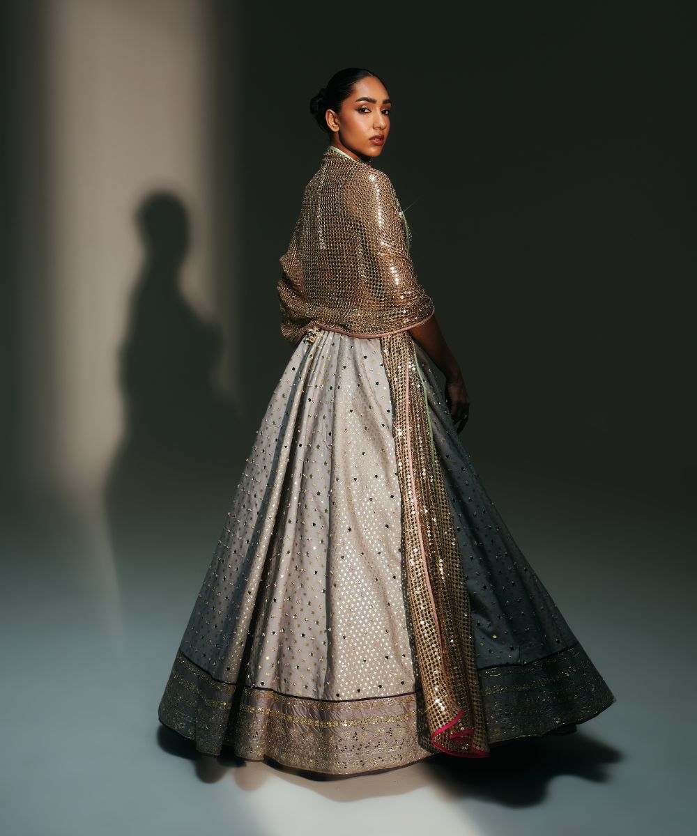 CHANDANI - HEAVY HAND EMBROIDERED KALI LEHENGA PAIRED WITH BRALETTE BLOUSE WITH CRIS-CROSS DEATILING AT THE BACK - Mehfil by Mahima