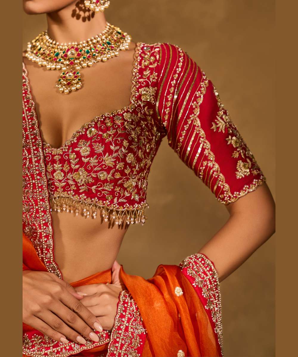 AARIANA LEHENGA - Orange to red ombré raw silk lehenga intricately embellished with zardozi, sequence ,glass beads and pearls paired with a delicately encrusted elbow-sleeve blouse - Leher by Chamee and Palak