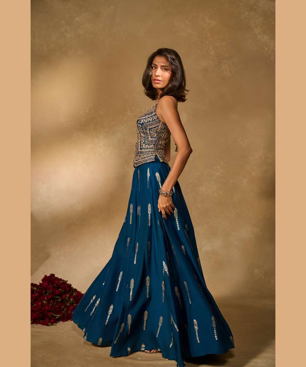 AMAL LEHENGA IN BLUE - Jamewar Lehenga with woven buttis paired with zari, sequence and zardozi embroidered halter neck blouse - Leher by Chamee and palak