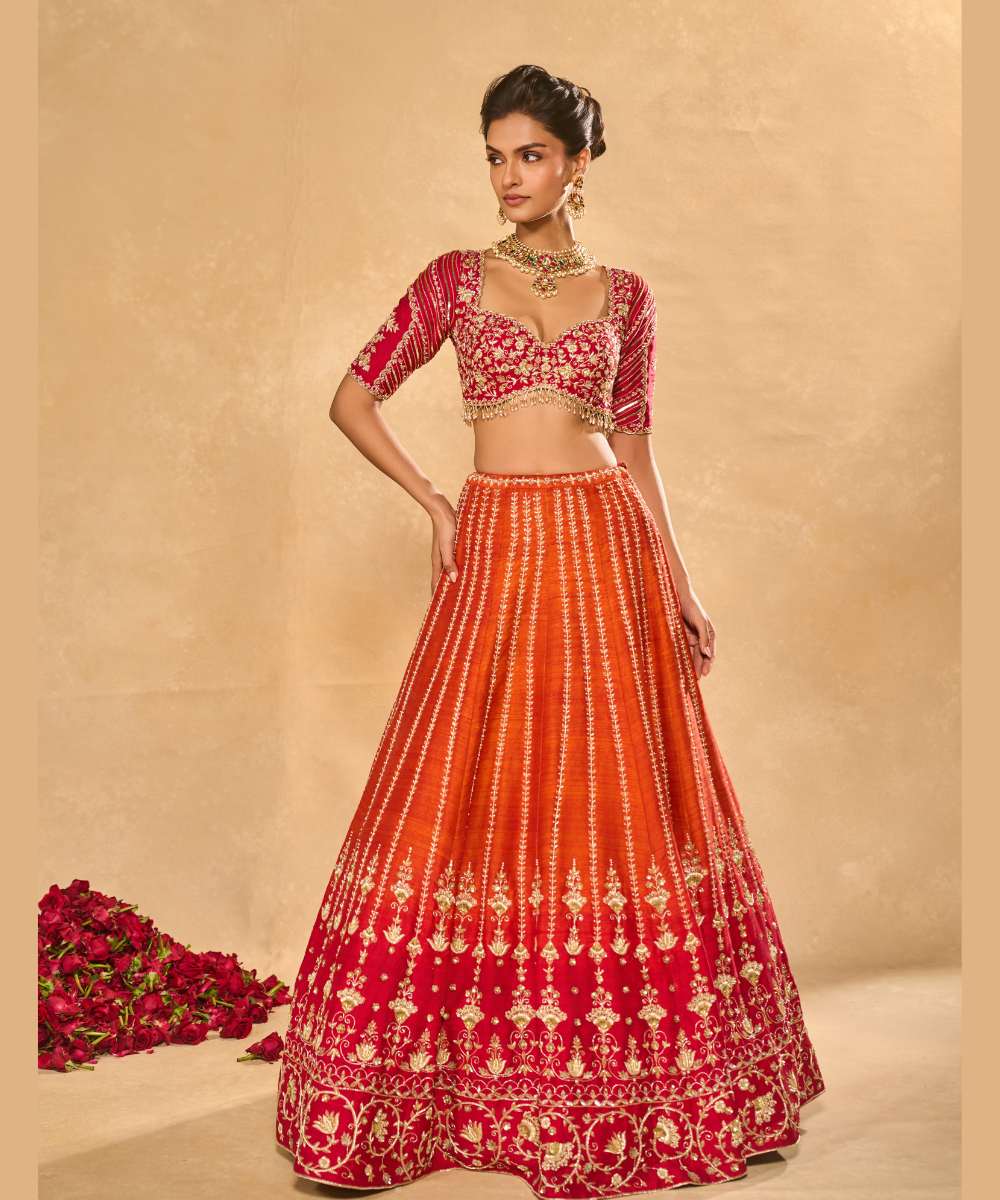 AARIANA LEHENGA - Orange to red ombré raw silk lehenga intricately embellished with zardozi, sequence ,glass beads and pearls paired with a delicately encrusted elbow-sleeve blouse - Leher by Chamee and Palak