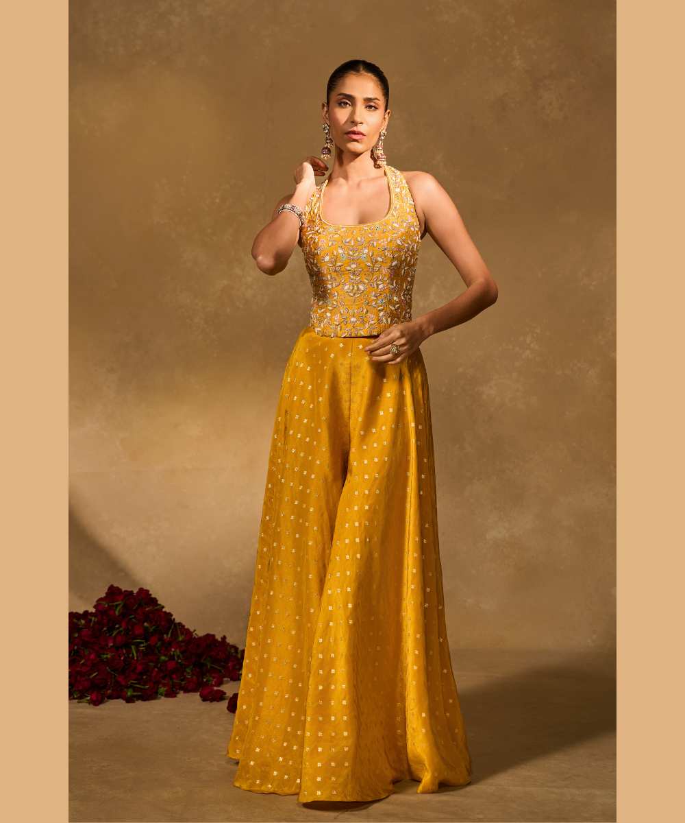 RIZ WITH TISSUE PANTS - Woven flared pant paired with a raw silk halter corset blouse -  Leher by Chamee and Palak