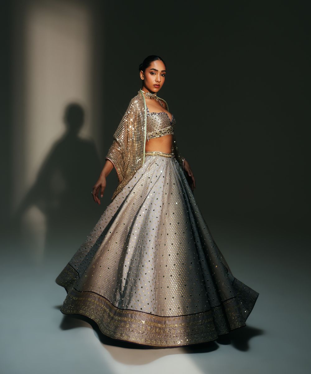 CHANDANI - HEAVY HAND EMBROIDERED KALI LEHENGA PAIRED WITH BRALETTE BLOUSE WITH CRIS-CROSS DEATILING AT THE BACK - Mehfil by Mahima
