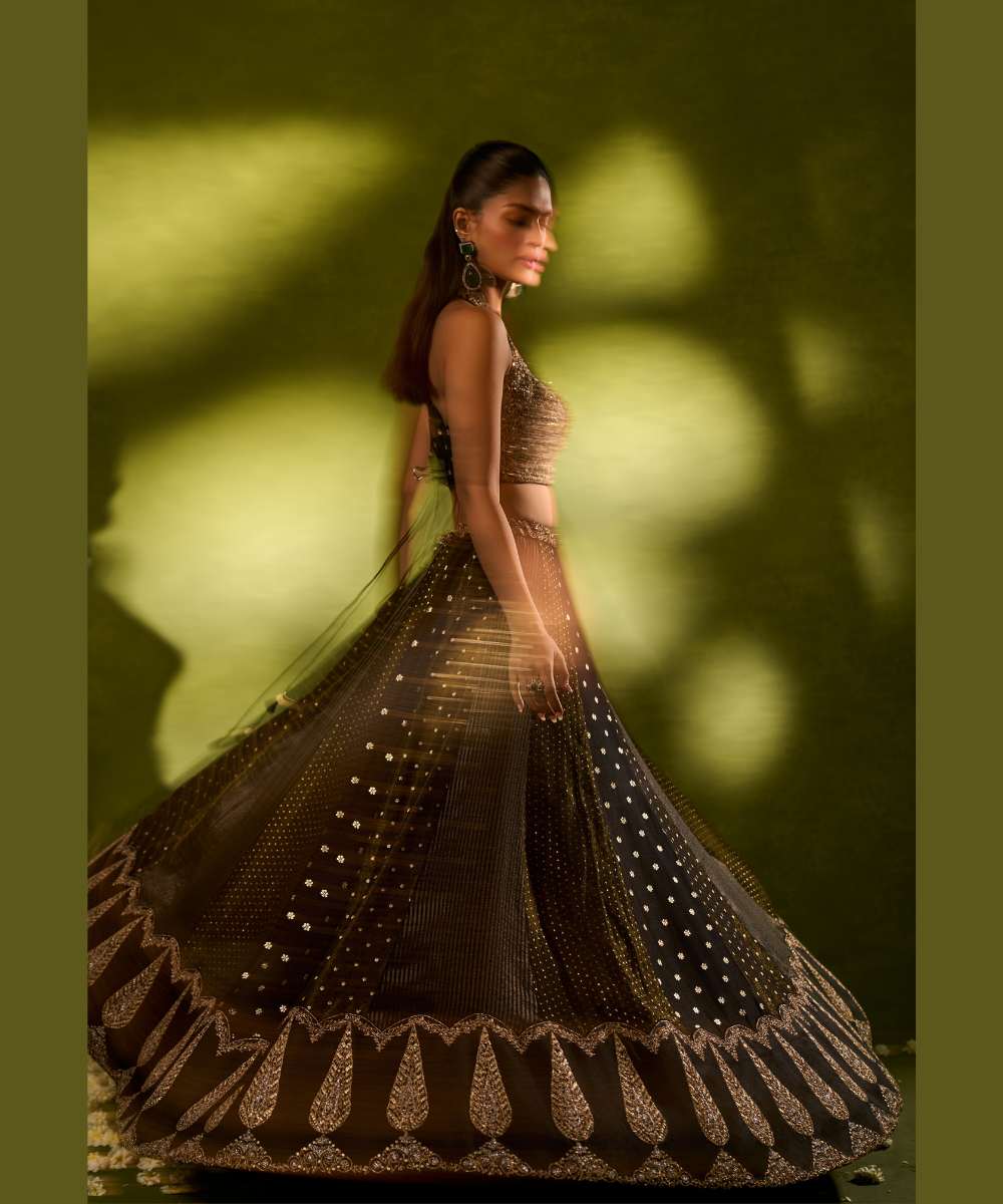 NANDANA LEHENGA - Black tissue woven jamewar lehenga delicately embroidered with a zari hem paired with a richly embroidered halter-neck blouse - Leher by Chamee and Palak