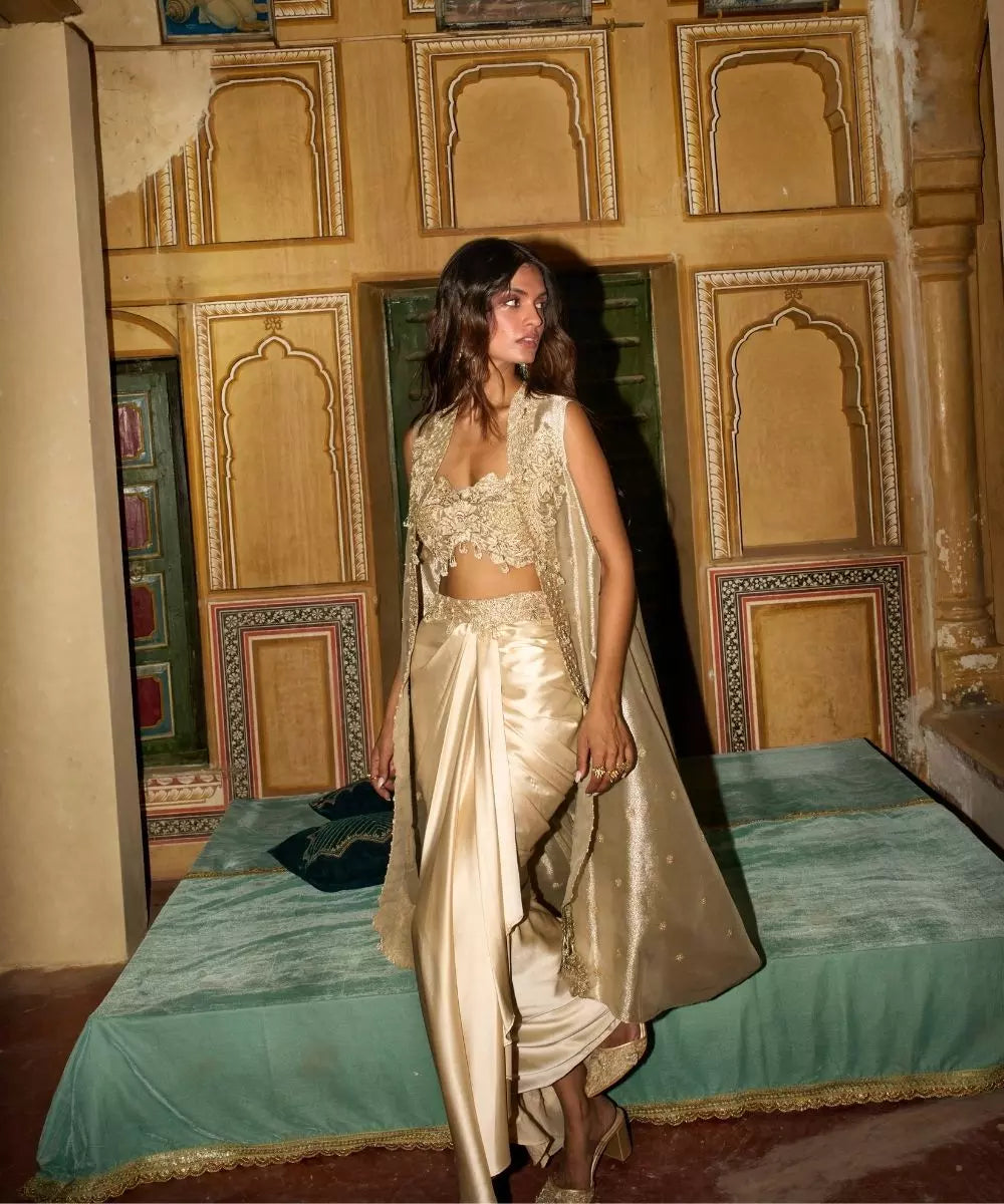 Aditi Gupta -  Champagne Gold drape Satin Skirt  Set with pure Tissue Cape