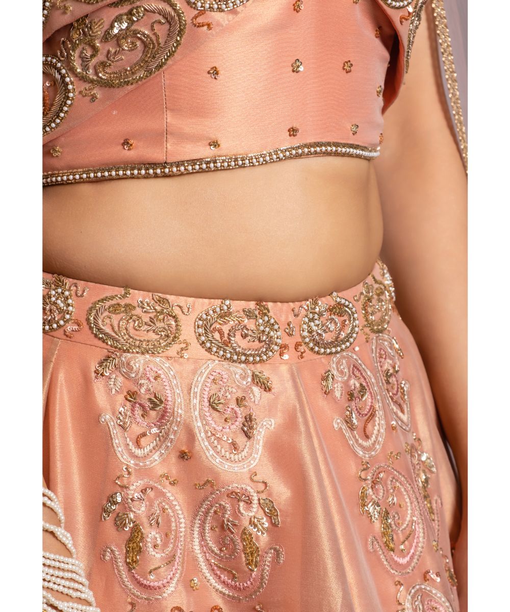 Peach tissue Lehenga with a Draped Blouse