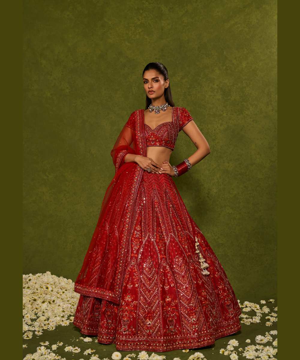 INDIRA LEHENGA - Red raw silk floral embroidered lehenga with thread, sequence, zardozi and glassbeads detailing paired with a sweetheart neck cap sleeve heavily embroidered blouse - Leher by Chamee and Palak