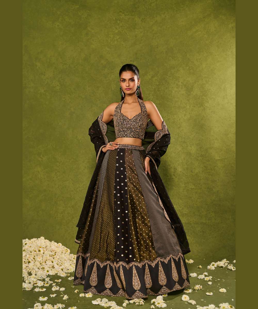 NANDANA LEHENGA - Black tissue woven jamewar lehenga delicately embroidered with a zari hem paired with a richly embroidered halter-neck blouse - Leher by Chamee and Palak