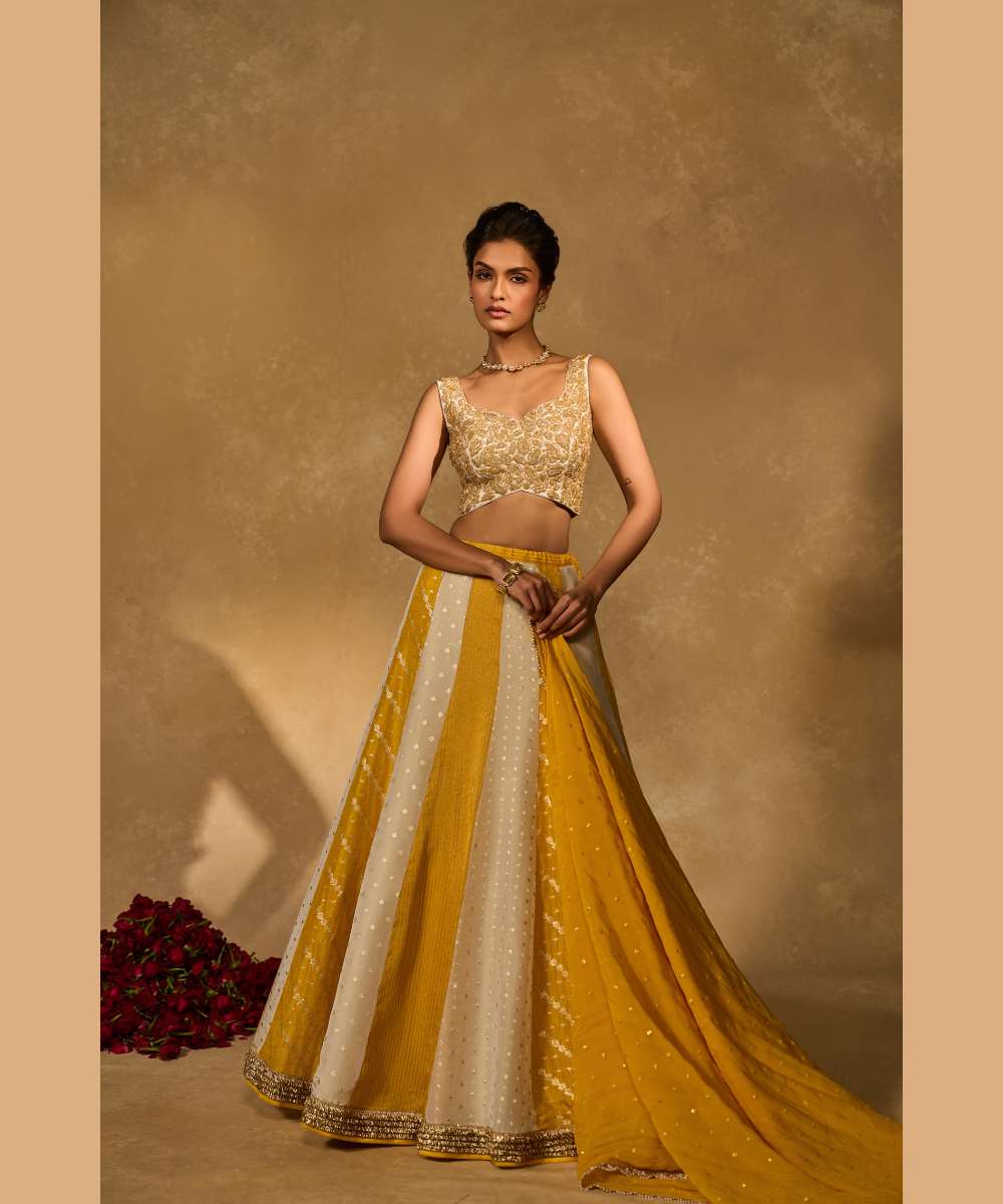 BHUMI LEHENGA - Ivory and yellow tissue jamewar lehenga with yellow organza dupatta encrusted with shimmering sequence -  Leher by Chamee and Palak