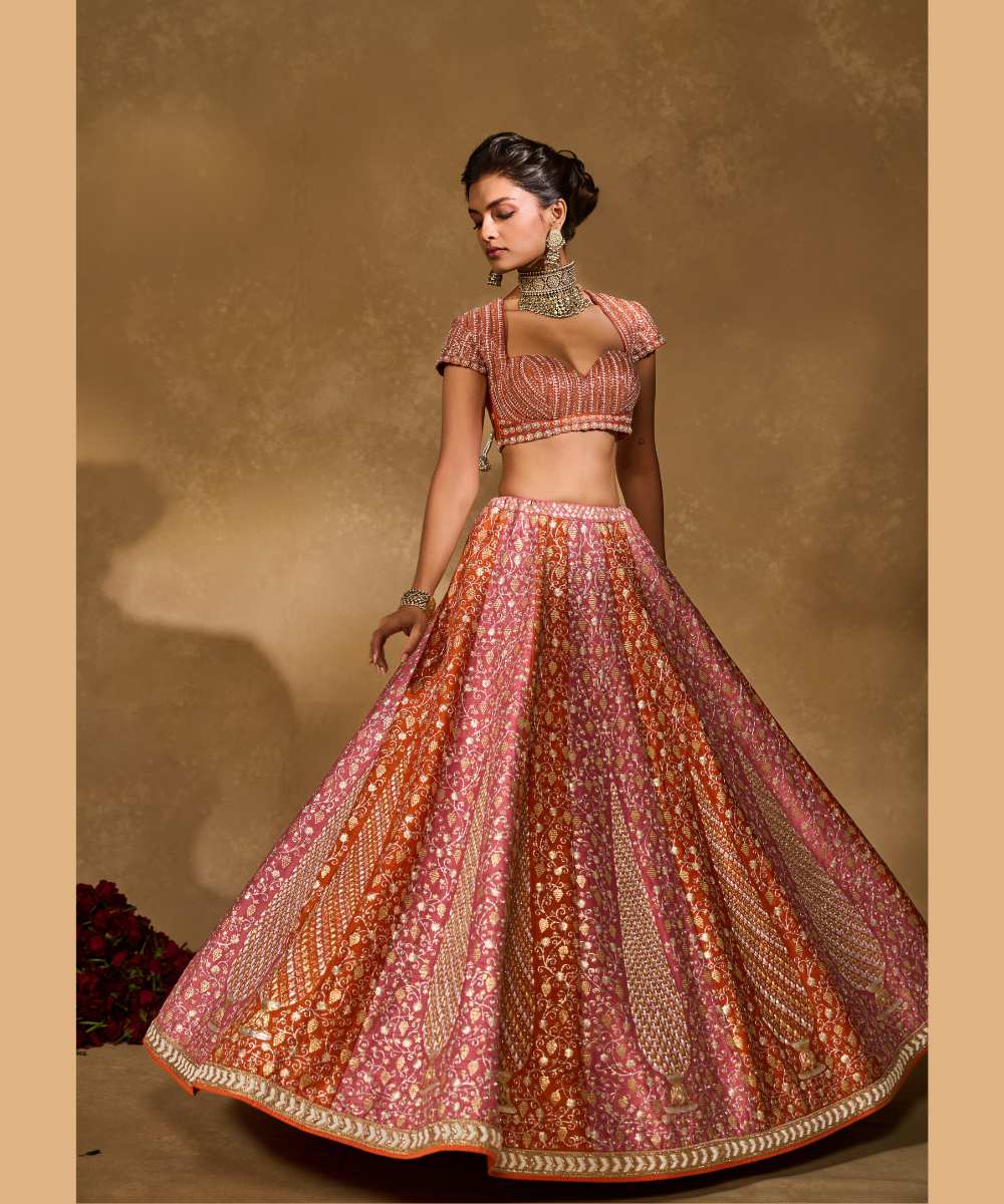 SABA LEHENGA - Mauve Pink and Orange lehenga intricately embroidered with pita, glass beads, stones, pearls, zardozi, and zari paired with a delicately embellished sweetheart neck cap sleeve blouse -  Leher by Chamee and Palak