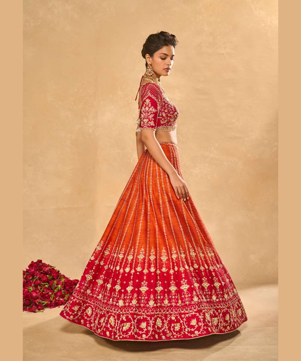 AARIANA LEHENGA - Orange to red ombré raw silk lehenga intricately embellished with zardozi, sequence ,glass beads and pearls paired with a delicately encrusted elbow-sleeve blouse - Leher by Chamee and Palak