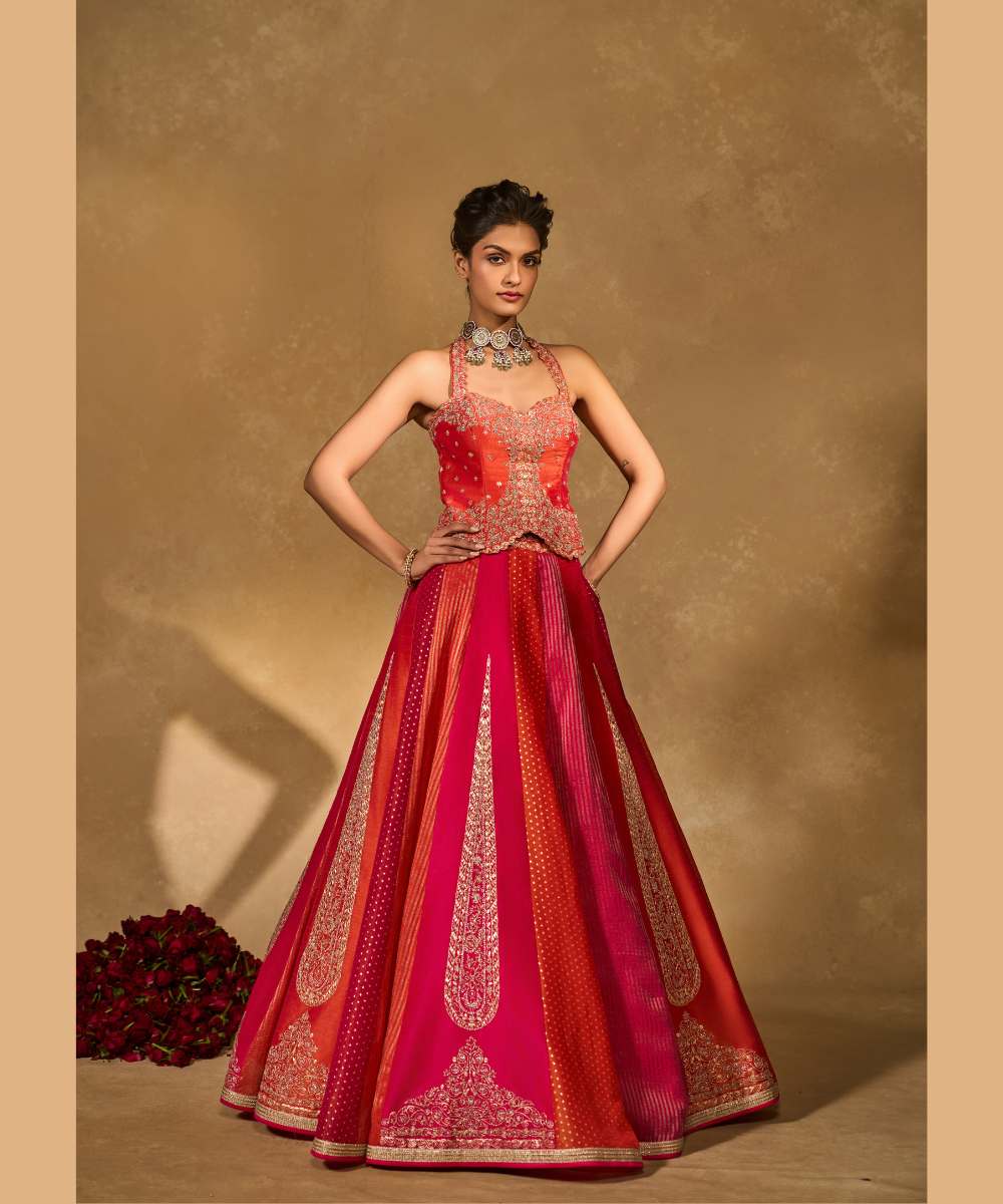 ORANGE NAINA LEHENGA - Orange and Pink dupion silk and tissue jamewar 6 kali lehenga, intricately woven and delicately encrusted with zari embroidery paired with an orange halter-neck blouse - Leher by Chamee and Palak
