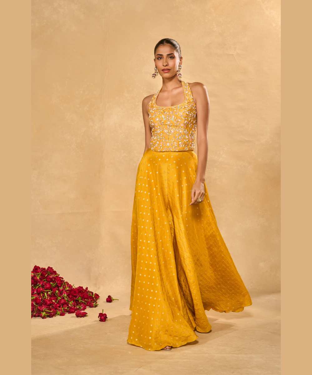 RIZ WITH TISSUE PANTS - Woven flared pant paired with a raw silk halter corset blouse -  Leher by Chamee and Palak