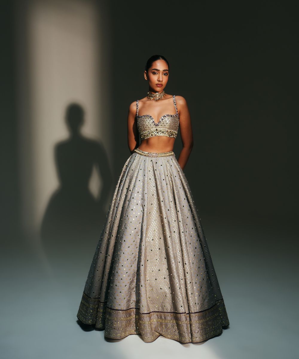 LEELA - HEAVY HAND EMBROIDERED KALI LEHENGA WITH BRALETTE WITH CRIS-CROSS DEATILING AT THE BACK AND CONTRAST DUPATTA - Mehfil by Mahima Mahajan