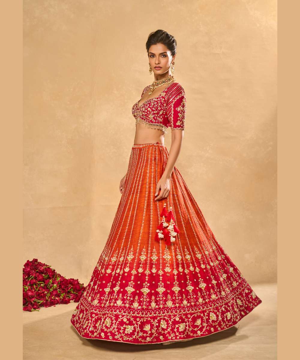 AARIANA LEHENGA - Orange to red ombré raw silk lehenga intricately embellished with zardozi, sequence ,glass beads and pearls paired with a delicately encrusted elbow-sleeve blouse - Leher by Chamee and Palak