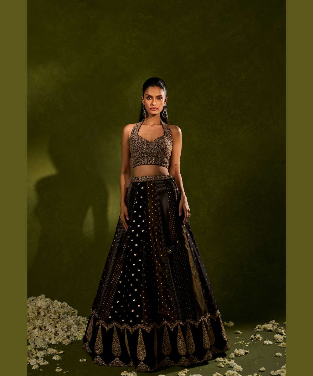 NANDANA LEHENGA - Black tissue woven jamewar lehenga delicately embroidered with a zari hem paired with a richly embroidered halter-neck blouse - Leher by Chamee and Palak
