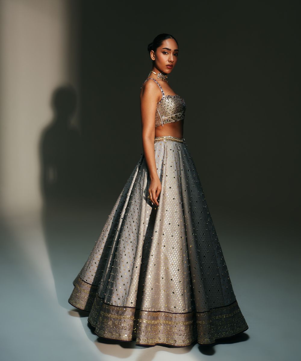 LEELA - HEAVY HAND EMBROIDERED KALI LEHENGA WITH BRALETTE WITH CRIS-CROSS DEATILING AT THE BACK AND CONTRAST DUPATTA - Mehfil by Mahima Mahajan