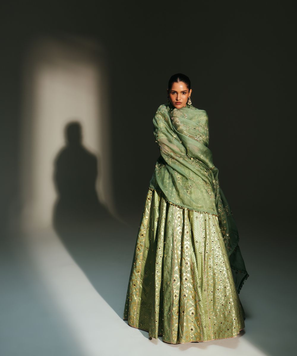 JIYA - HEAVY HAND EMBROIDERED PISTA GREEN KALI LEHENGA - Mehfil by Mahima Mahajan