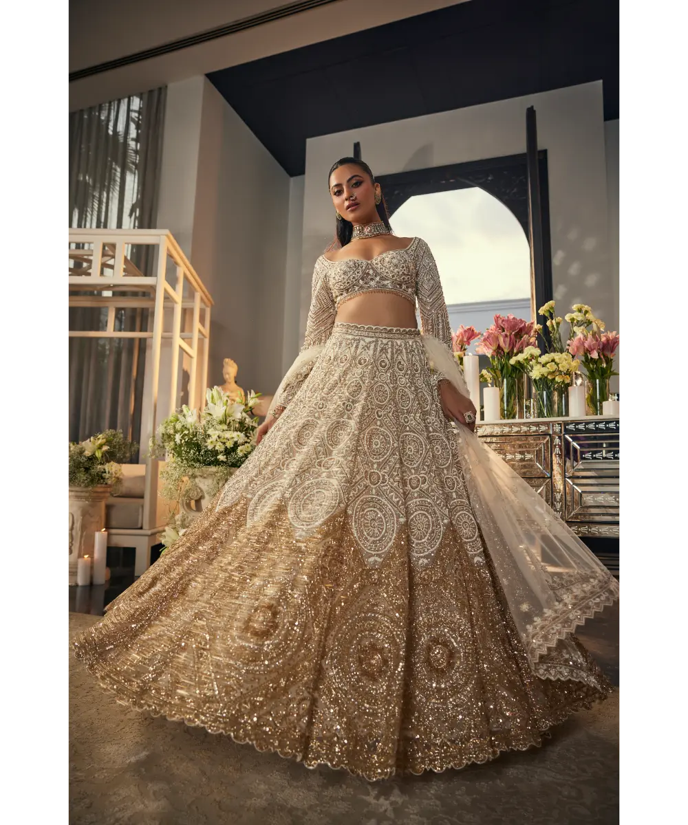 ISA BY DOLLY WAHAL - Ivory & Gold Net Sequins & Cutdana Embroidered Lehenga Set