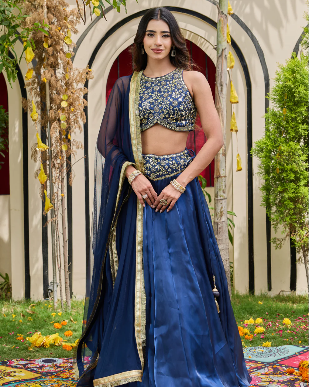 Deepika Chadha - Navy blue blouse and shimmer organza lehnga set From Heer